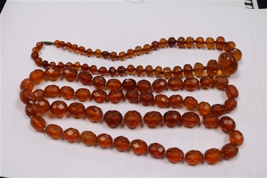 Five assorted amber necklaces.